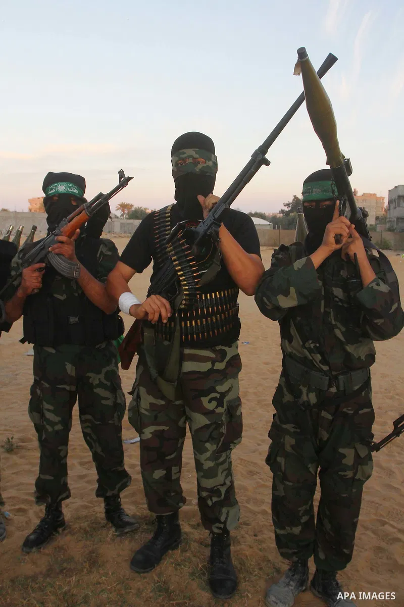 Armed Palestinian Hamas militants keep patrol near the Rafah crossing with Egypt in the southern Gaza Strip on October 18, 2011 as an Israeli-Palestinian prisoner swap deal gets under way. Buses carrying 477 Palestinian...