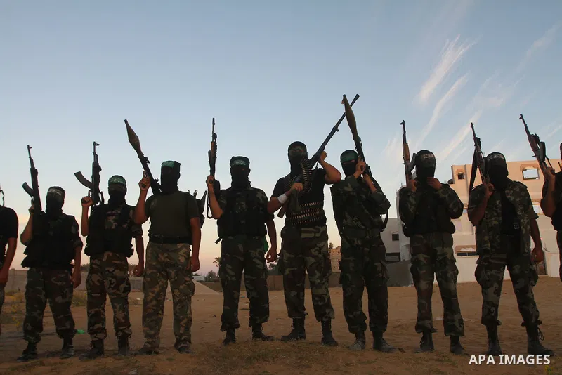 Armed Palestinian Hamas militants keep patrol near the Rafah crossing with Egypt in the southern Gaza Strip on October 18, 2011 as an Israeli-Palestinian prisoner swap deal gets under way. Buses carrying 477 Palestinian...