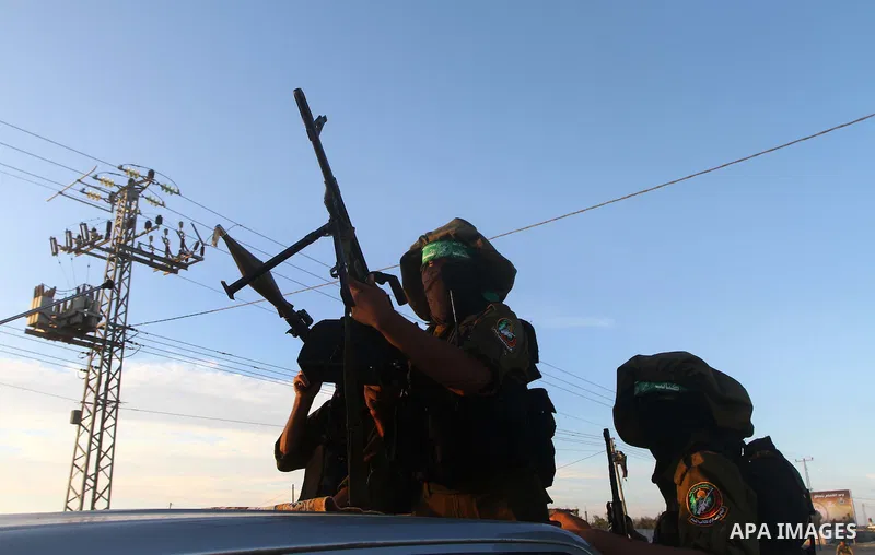 Armed Palestinian Hamas militants keep patrol near the Rafah crossing with Egypt in the southern Gaza Strip on October 18, 2011 as an Israeli-Palestinian prisoner swap deal gets under way. Buses carrying 477 Palestinian...