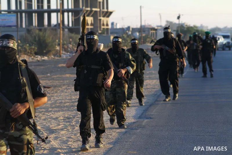 Armed Palestinian Hamas militants keep patrol near the Rafah crossing with Egypt in the southern Gaza Strip on October 18, 2011 as an Israeli-Palestinian prisoner swap deal gets under way. Buses carrying 477 Palestinian...