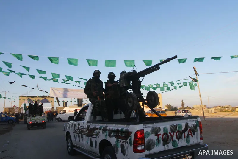 Armed Palestinian Hamas militants keep patrol near the Rafah crossing with Egypt in the southern Gaza Strip on October 18, 2011 as an Israeli-Palestinian prisoner swap deal gets under way. Buses carrying 477 Palestinian...