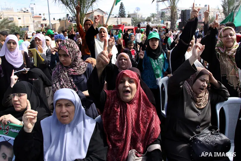Relatives of Palestinian prisoners about to be freed in a prisoner swap between Hamas and Israel, celebrate as they prepare to receive them in Gaza city October 18, 2011. Gaza's Hamas Islamist rulers released captured Is...