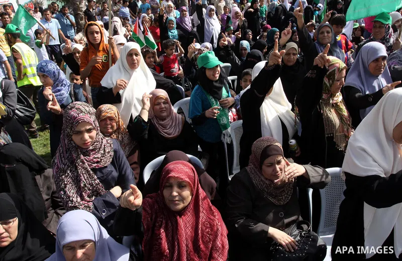 Relatives of Palestinian prisoners about to be freed in a prisoner swap between Hamas and Israel, celebrate as they prepare to receive them in Gaza city October 18, 2011. Gaza's Hamas Islamist rulers released captured Is...