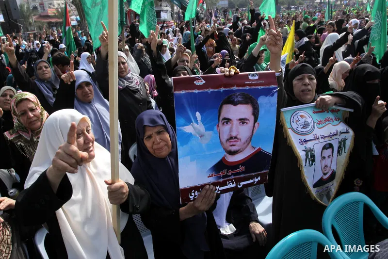 Relatives of Palestinian prisoners about to be freed in a prisoner swap between Hamas and Israel, celebrate as they prepare to receive them in Gaza city October 18, 2011. Gaza's Hamas Islamist rulers released captured Is...