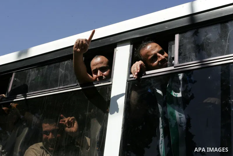 Palestinian prisoners cross to the southern Gaza Strip from the Egyptian side of the Rafah border on Oct. 18, 2011 upon their release from Israeli prisons under a landmark deal to free abducted Israeli soldier Gilad Shal...