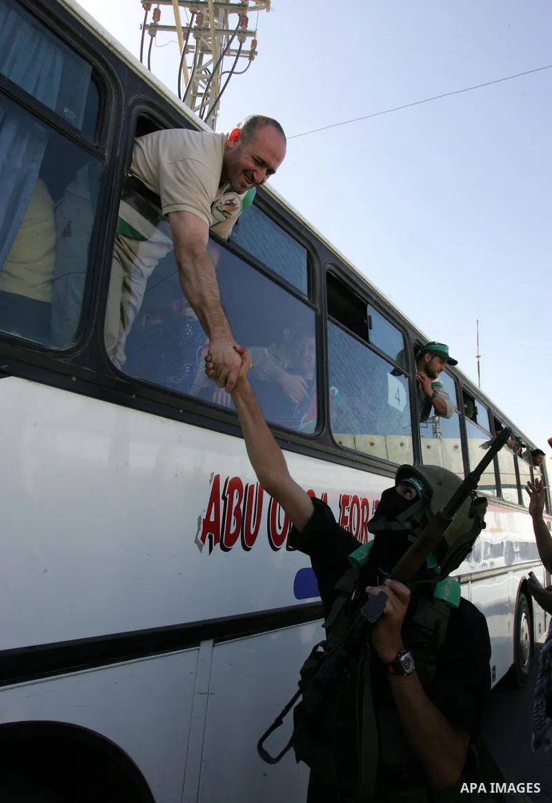 Palestinian prisoners cross to the southern Gaza Strip from the Egyptian side of the Rafah border on Oct. 18, 2011 upon their release from Israeli prisons under a landmark deal to free abducted Israeli soldier Gilad Shal...