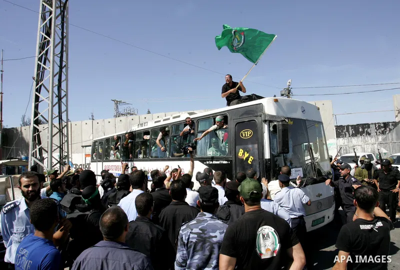 Palestinian prisoners cross to the southern Gaza Strip from the Egyptian side of the Rafah border on Oct. 18, 2011 upon their release from Israeli prisons under a landmark deal to free abducted Israeli soldier Gilad Shal...