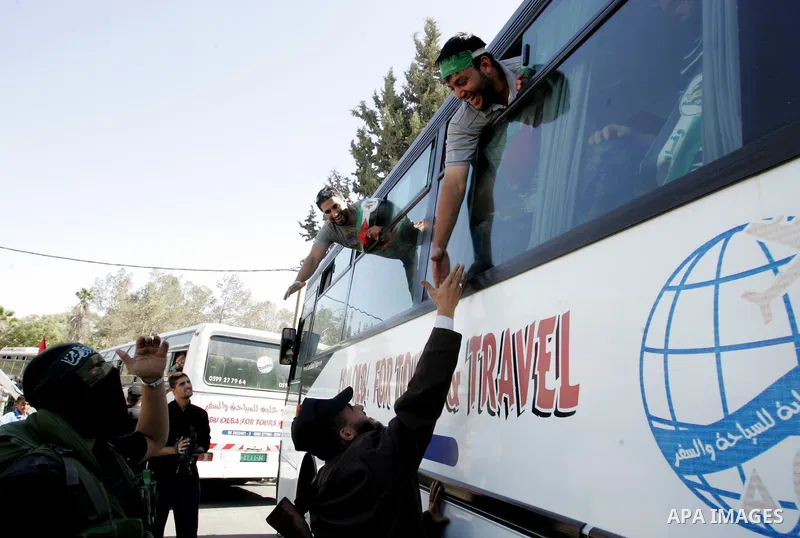 Palestinian prisoners cross to the southern Gaza Strip from the Egyptian side of the Rafah border on Oct. 18, 2011 upon their release from Israeli prisons under a landmark deal to free abducted Israeli soldier Gilad Shal...