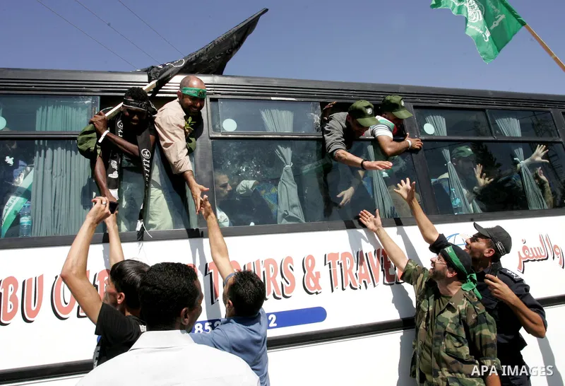 Palestinian prisoners cross to the southern Gaza Strip from the Egyptian side of the Rafah border on Oct. 18, 2011 upon their release from Israeli prisons under a landmark deal to free abducted Israeli soldier Gilad Shal...