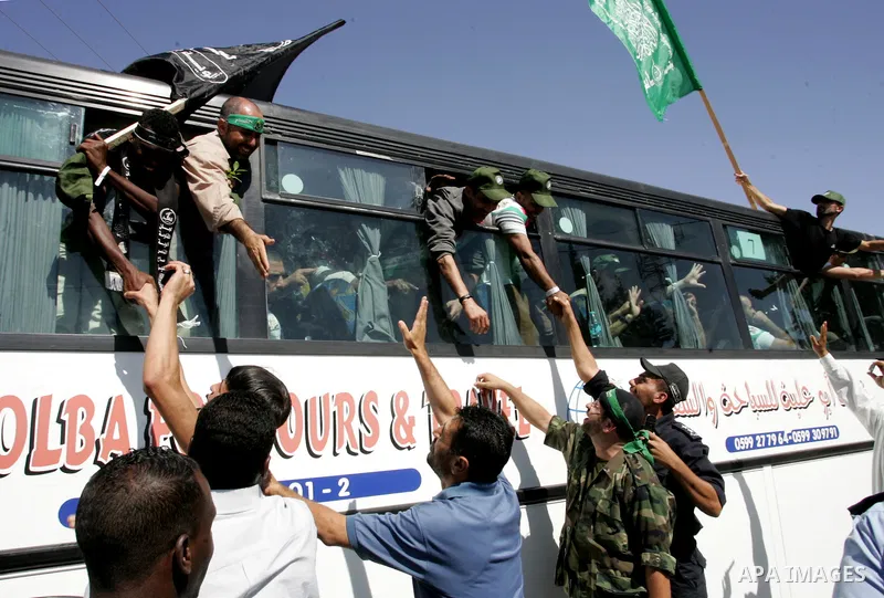 Palestinian prisoners cross to the southern Gaza Strip from the Egyptian side of the Rafah border on Oct. 18, 2011 upon their release from Israeli prisons under a landmark deal to free abducted Israeli soldier Gilad Shal...
