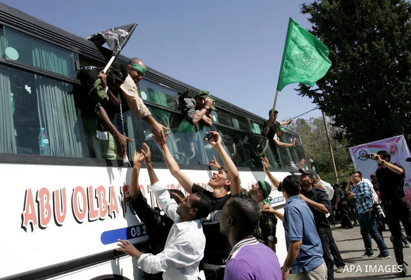Palestinian prisoners cross to the southern Gaza Strip from the Egyptian side of the Rafah border on Oct. 18, 2011 upon their release from Israeli prisons under a landmark deal to free abducted Israeli soldier Gilad Shal...