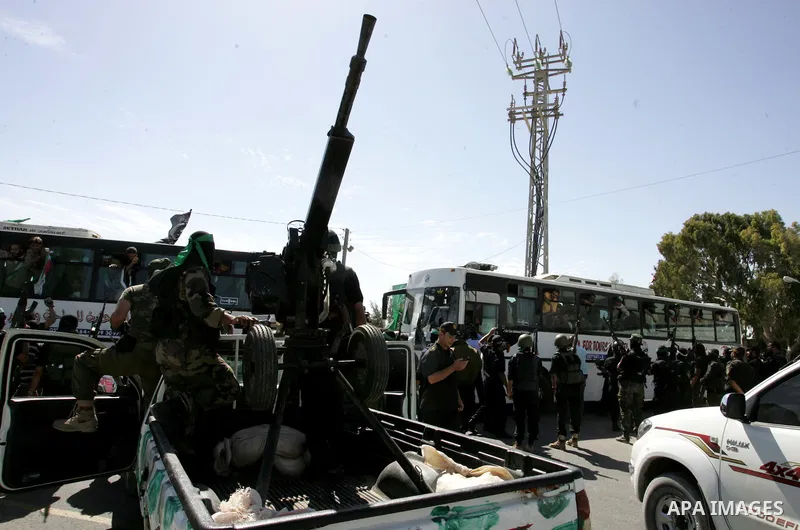 Palestinian prisoners cross to the southern Gaza Strip from the Egyptian side of the Rafah border on Oct. 18, 2011 upon their release from Israeli prisons under a landmark deal to free abducted Israeli soldier Gilad Shal...