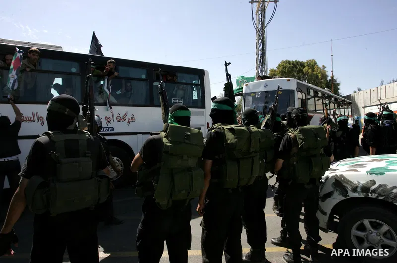 Palestinian prisoners cross to the southern Gaza Strip from the Egyptian side of the Rafah border on Oct. 18, 2011 upon their release from Israeli prisons under a landmark deal to free abducted Israeli soldier Gilad Shal...