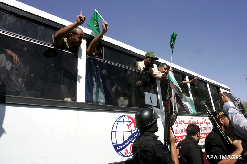 Palestinian prisoners cross to the southern Gaza Strip from the Egyptian side of the Rafah border on Oct. 18, 2011 upon their release from Israeli prisons under a landmark deal to free abducted Israeli soldier Gilad Shal...