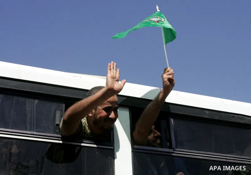 Palestinian prisoners cross to the southern Gaza Strip from the Egyptian side of the Rafah border on Oct. 18, 2011 upon their release from Israeli prisons under a landmark deal to free abducted Israeli soldier Gilad Shal...