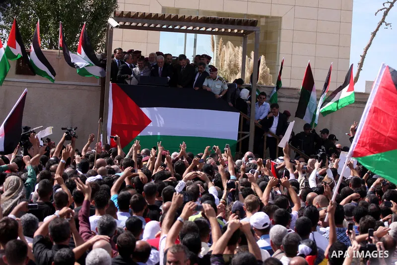 Palestinian president Mahmud Abbas welcomes hundreds of prisoners released from Israeli jails on Oct. 18, 2011 at the Palestinian Authority headquarters in the West Bank city of Ramallah. Hundreds of people gathered in R...