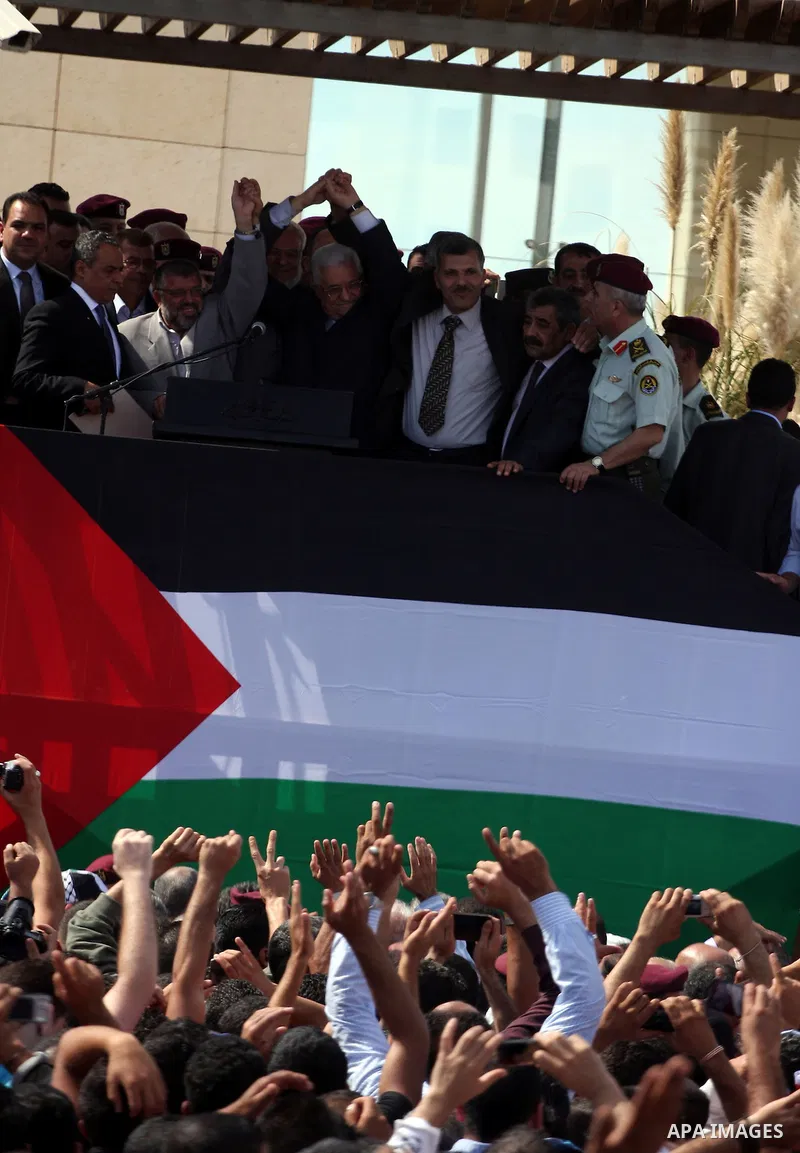 Palestinian president Mahmud Abbas welcomes hundreds of prisoners released from Israeli jails on Oct. 18, 2011 at the Palestinian Authority headquarters in the West Bank city of Ramallah. Hundreds of people gathered in R...