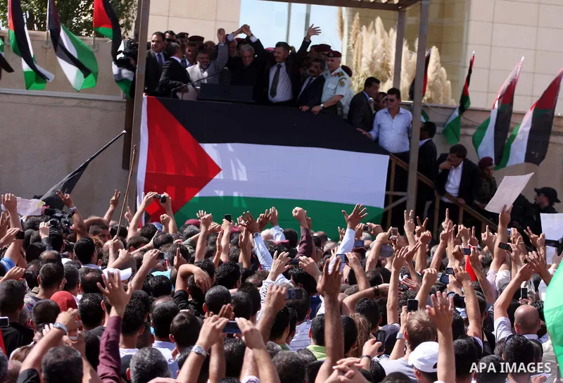 Palestinian president Mahmud Abbas welcomes hundreds of prisoners released from Israeli jails on Oct. 18, 2011 at the Palestinian Authority headquarters in the West Bank city of Ramallah. Hundreds of people gathered in R...