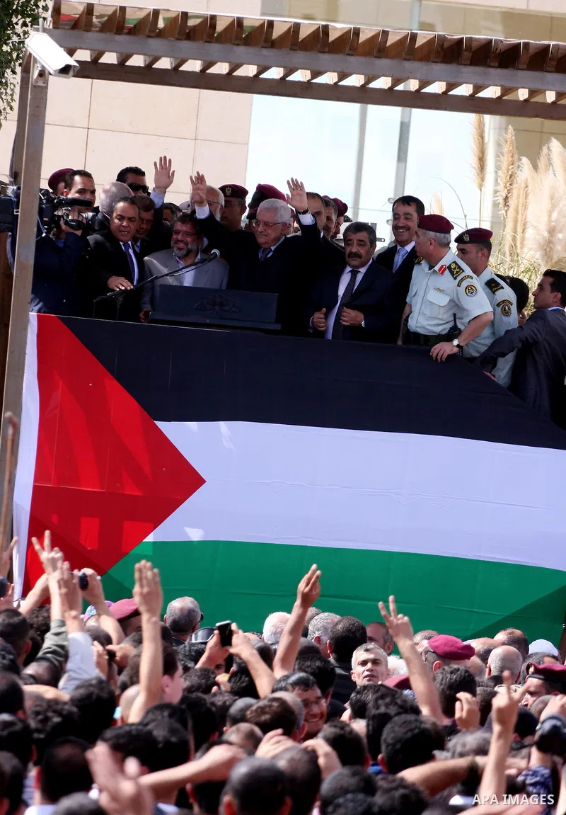Palestinian president Mahmud Abbas welcomes hundreds of prisoners released from Israeli jails on Oct. 18, 2011 at the Palestinian Authority headquarters in the West Bank city of Ramallah. Hundreds of people gathered in R...
