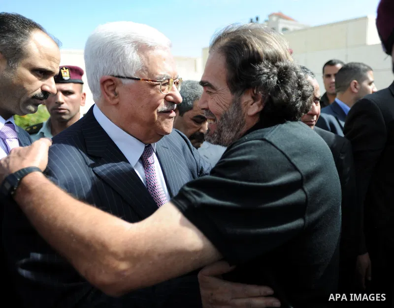 Palestinian president Mahmud Abbas welcomes hundreds of prisoners released from Israeli jails on Oct. 18, 2011 at the Palestinian Authority headquarters in the West Bank city of Ramallah. Hundreds of people gathered in R...