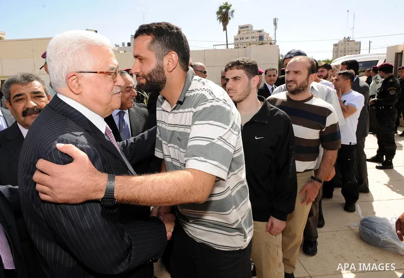 Palestinian president Mahmud Abbas welcomes hundreds of prisoners released from Israeli jails on Oct. 18, 2011 at the Palestinian Authority headquarters in the West Bank city of Ramallah. Hundreds of people gathered in R...