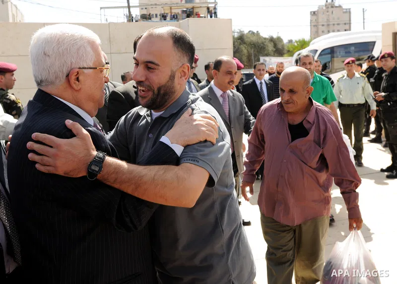 Palestinian president Mahmud Abbas welcomes hundreds of prisoners released from Israeli jails on Oct. 18, 2011 at the Palestinian Authority headquarters in the West Bank city of Ramallah. Hundreds of people gathered in R...