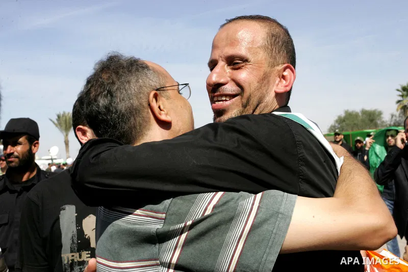 Palestinians greet their relative released Palestinian prisoner at the Rafah border crossing in southern Gaza Strip, Tuesday, Oct. 18, 2011. The Hamas militant group released an Israeli soldier Tuesday more than five yea...