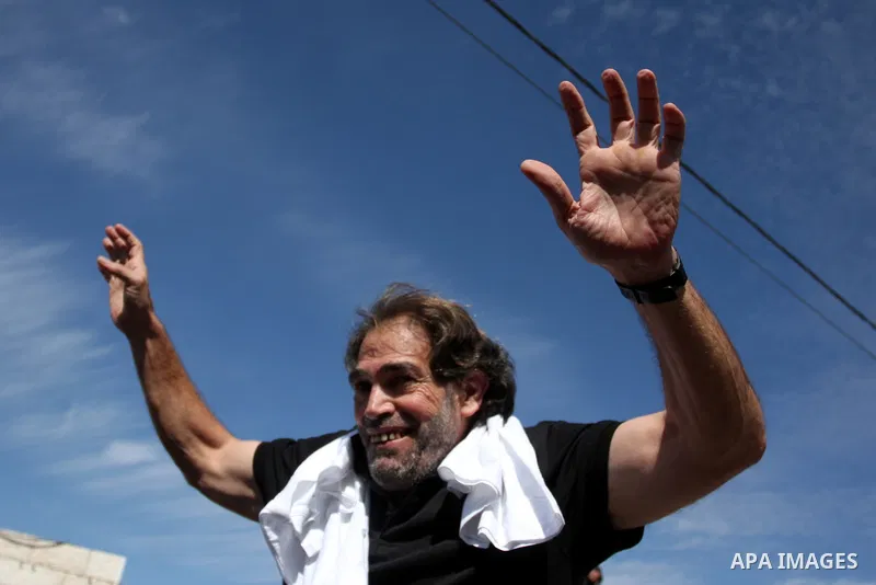A Palestinian prisoner is welcomed by a crowd following the release of hundreds of prisoners from Israeli jails on October 18,2011 at the Palestinian Authority headquarters in the West Bank city of Ramallah. Crowds of Pa...