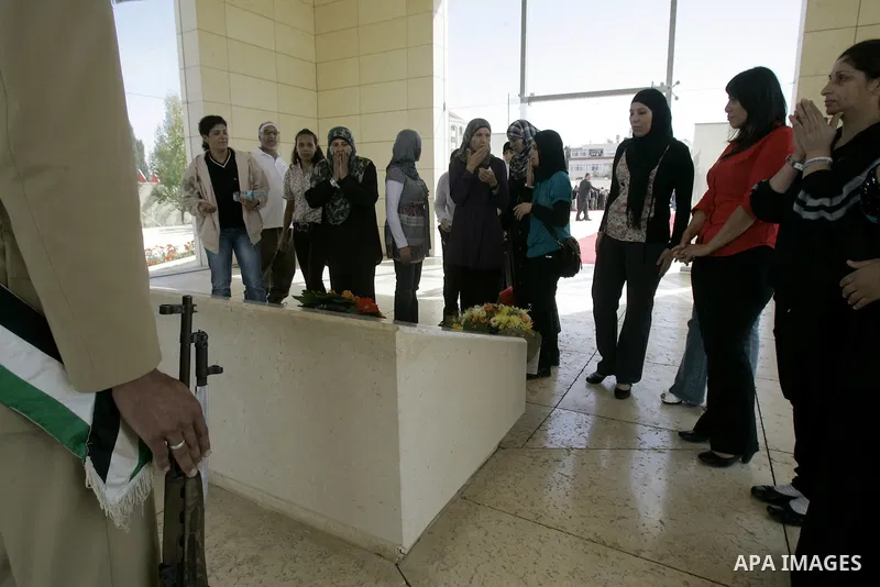 Released Palestinian prisoners read Holy Koran at the tomb of the late Palestinian President Yasser Arafat in the West Bank city of Ramallah, Tuesday, Oct. 18, 2011. Hamas agreed to release Israeli soldier Galit Schalit...