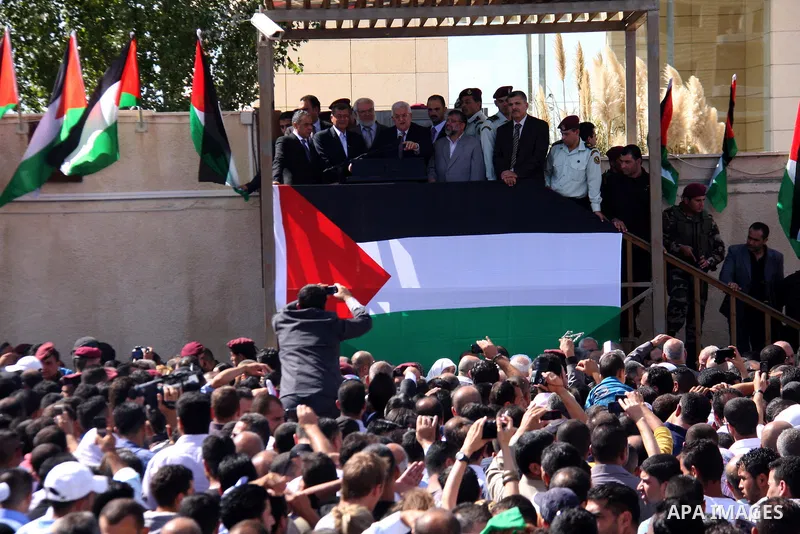 Palestinian president Mahmud Abbas welcomes hundreds of prisoners released from Israeli jails on Oct. 18, 2011 at the Palestinian Authority headquarters in the West Bank city of Ramallah. Hundreds of people gathered in R...
