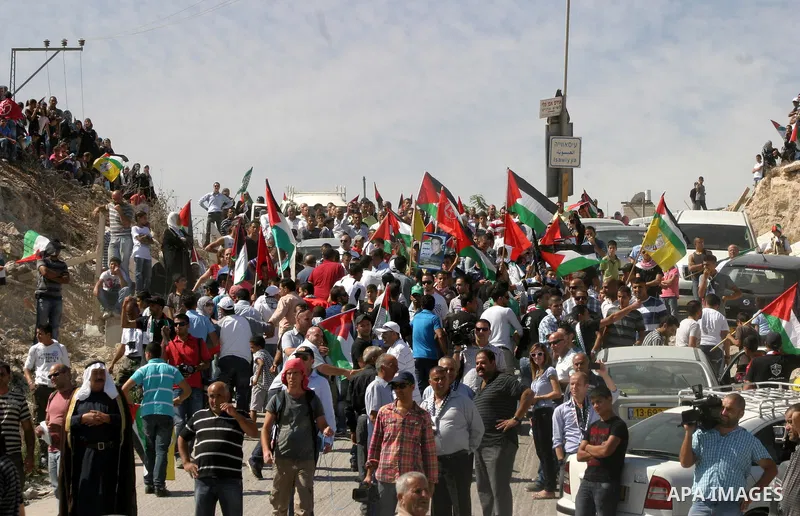 Palestinians wait for former prisoners to be released in East Jerusalem from Israeli prison, Tuesday, Oct. 18, 2011. Hamas agreed to release Israeli soldier Galit Schalit in exchange for 1,027 Palestinian prisoners, many...