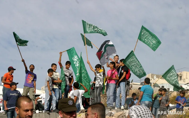 Palestinians wait for former prisoners to be released in East Jerusalem from Israeli prison, Tuesday, Oct. 18, 2011. Hamas agreed to release Israeli soldier Galit Schalit in exchange for 1,027 Palestinian prisoners, many...