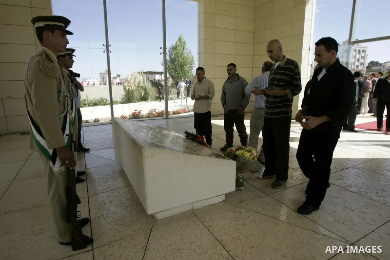 Released Palestinian prisoners read Holy Koran at the tomb of the late Palestinian President Yasser Arafat in the West Bank city of Ramallah, Tuesday, Oct. 18, 2011. Hamas agreed to release Israeli soldier Galit Schalit...