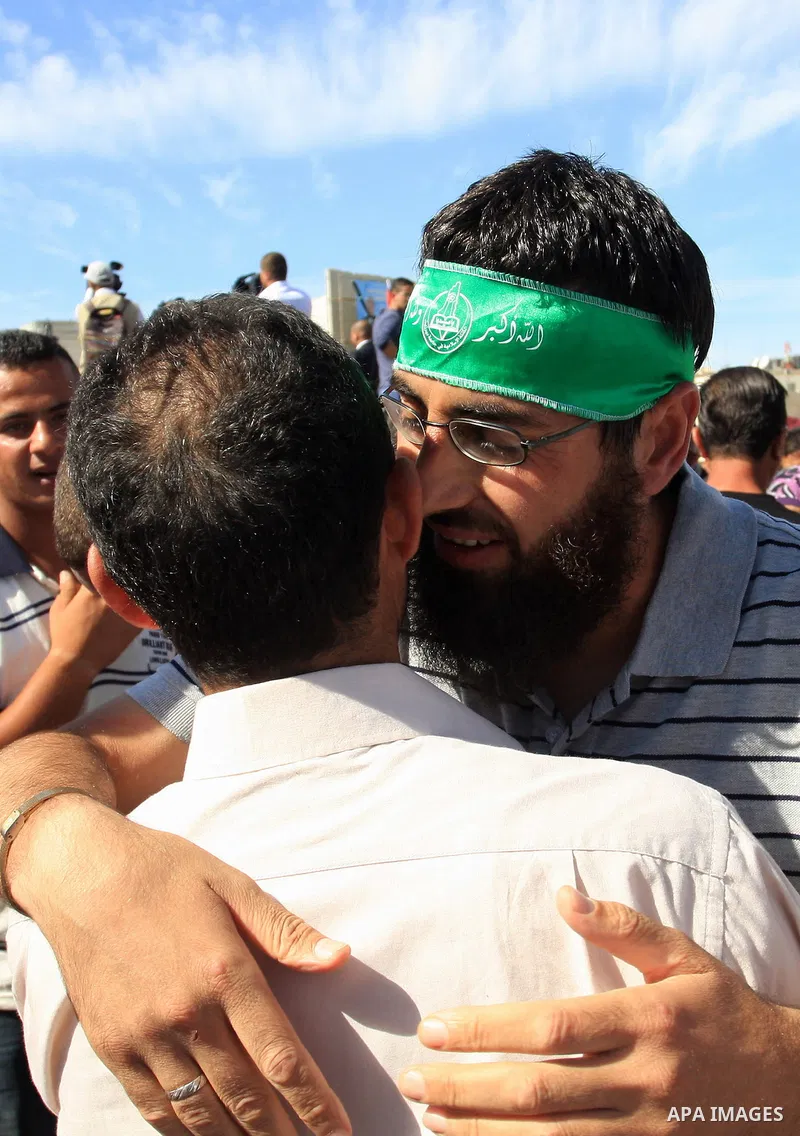 Freed Palestinian prisoners are welcomed home by their friends and relatives upon their arrival in Ramallah, the West Bank, 18 October 2011. 477 Palestinian prisoners were freed on 18 October 2011 in exchange for the rel...
