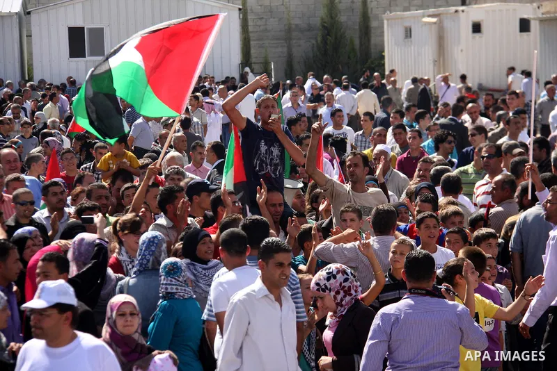 Freed Palestinian prisoners are welcomed home by their friends and relatives upon their arrival in Ramallah, the West Bank, 18 October 2011. 477 Palestinian prisoners were freed on 18 October 2011 in exchange for the rel...