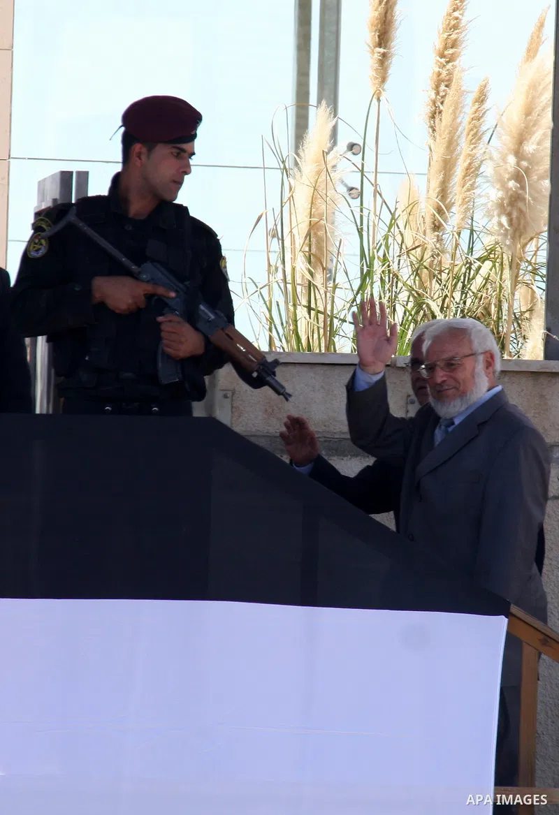 Freed Palestinian prisoners are welcomed home by Palestinian legislative council head, Aziz Dwaik upon their arrival in Ramallah, the West Bank, 18 October 2011. 477 Palestinian prisoners were freed on 18 October 2011 in...