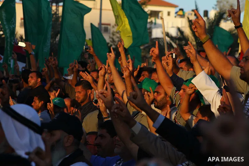 Palestinians celebrate the release of prisoners at the main square in Gaza City, Tuesday, Oct. 18, 2011. Hamas agreed to release Israeli soldier Gilad Schalit in exchange for 1,027 Palestinian prisoners, many of them ser...