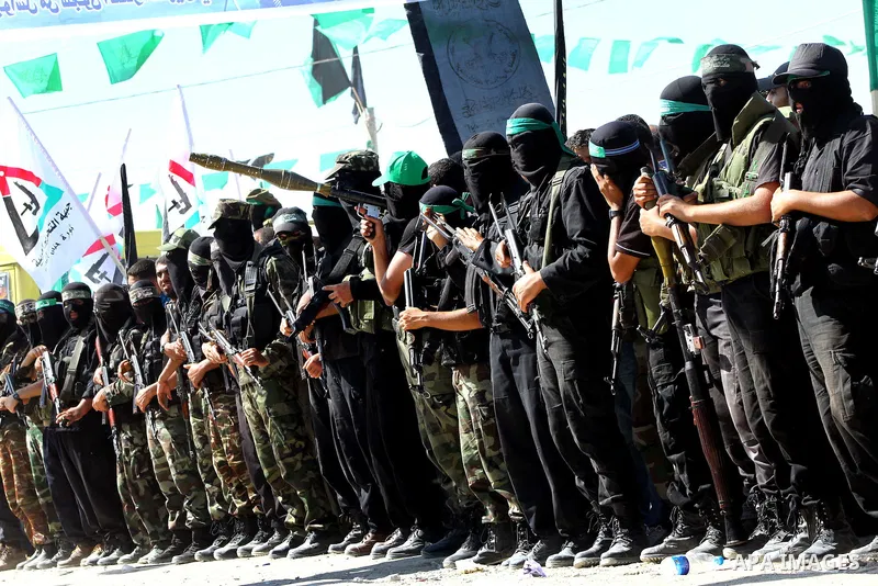 Hamas militants stand guard near Rafah Crossing through which Palestinian prisoners going to be freed in a prisoner swap between Hamas and Israel will enter the Gaza Strip on 18 October 2011 As Gilad Shalit, the Israeli...
