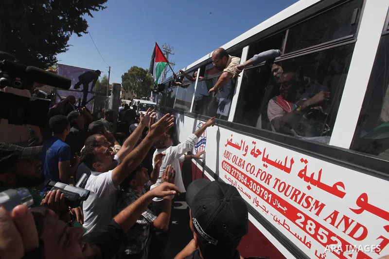Palestinian prisoners cross to the southern Gaza Strip from the Egyptian side of the Rafah border on Oct. 18, 2011 upon their release from Israeli prisons under a landmark deal to free abducted Israeli soldier Gilad Shal...