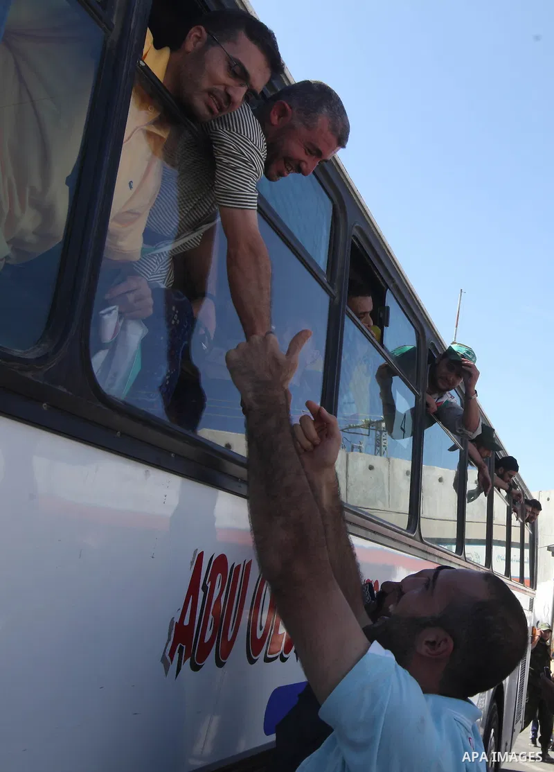 Palestinian prisoners cross to the southern Gaza Strip from the Egyptian side of the Rafah border on Oct. 18, 2011 upon their release from Israeli prisons under a landmark deal to free abducted Israeli soldier Gilad Shal...