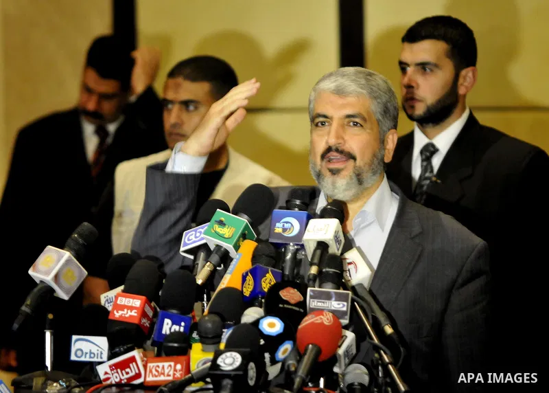 Exiled Palestinian Hamas leader Khaled Meshaal addresses a meeting with some 40 Palestinian prisoners who were freed by Israel but are to be deported overseas, in Cairo on October 18, 2011. Israeli soldier Gilad Shalit w...