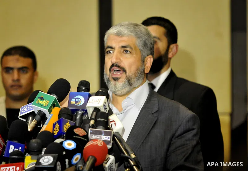 Exiled Palestinian Hamas leader Khaled Meshaal addresses a meeting with some 40 Palestinian prisoners who were freed by Israel but are to be deported overseas, in Cairo on October 18, 2011. Israeli soldier Gilad Shalit w...