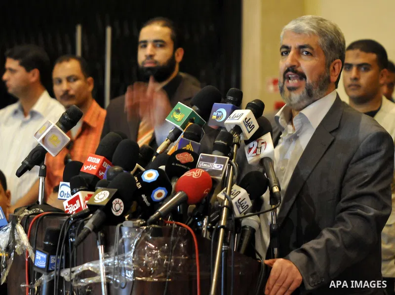 Exiled Palestinian Hamas leader Khaled Meshaal addresses a meeting with some 40 Palestinian prisoners who were freed by Israel but are to be deported overseas, in Cairo on October 18, 2011. Israeli soldier Gilad Shalit w...
