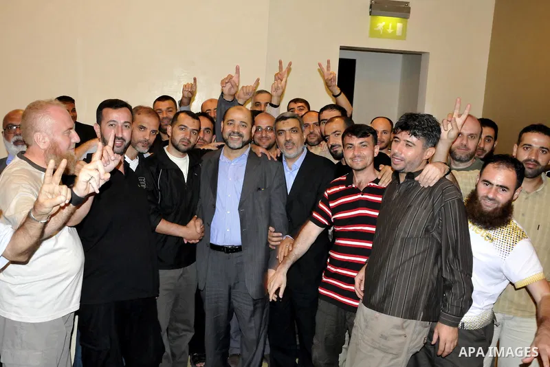 Palestinian released prisoners gather for a meeting with Hamas political leader Khaled Meshal, not pictured, in Cairo, Egypt, Tuesday, Oct. 18, 2011. Hundreds of Palestinians freed from Israeli prisons in exchange for th...