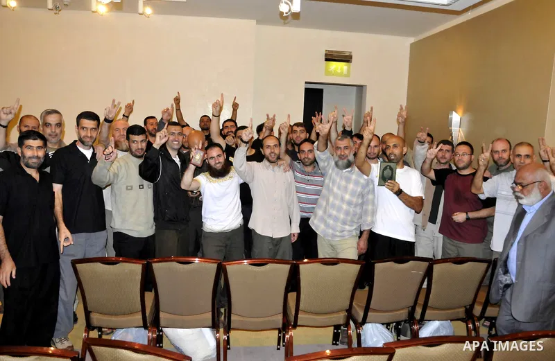 Palestinian released prisoners gather for a meeting with Hamas political leader Khaled Meshal, not pictured, in Cairo, Egypt, Tuesday, Oct. 18, 2011. Hundreds of Palestinians freed from Israeli prisons in exchange for th...