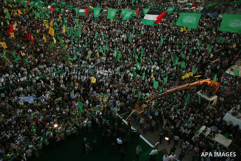 Thousands of Palestinians attend the welcome ceremony held for the Palestinian prisoners released from Israel in al-Katiba Yard in Gaza City, Oct. 18, 2011. Israel and the Palestinians finished on Tuesday the first phase...