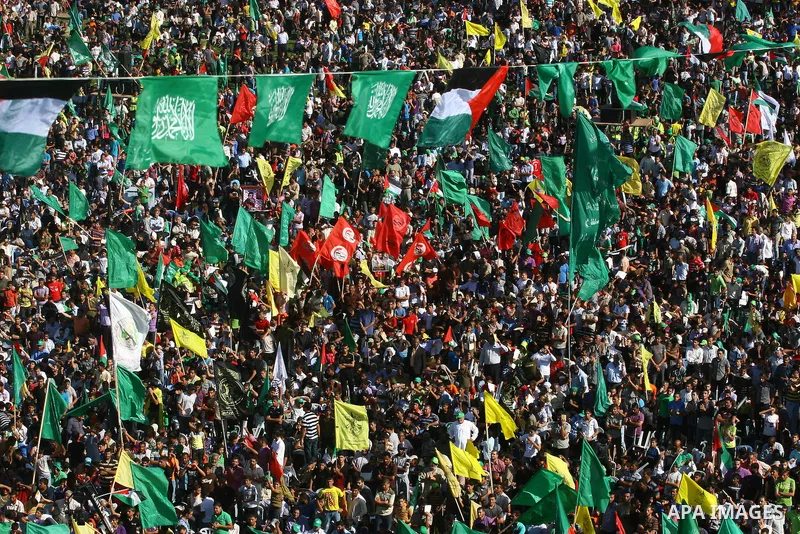 Thousands of Palestinians attend the welcome ceremony held for the Palestinian prisoners released from Israel in al-Katiba Yard in Gaza City, Oct. 18, 2011. Israel and the Palestinians finished on Tuesday the first phase...