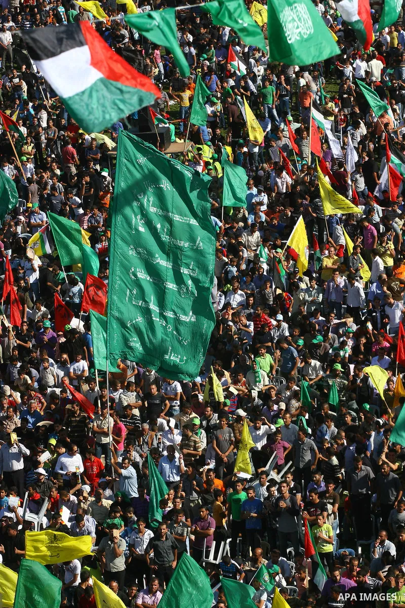 Thousands of Palestinians attend the welcome ceremony held for the Palestinian prisoners released from Israel in al-Katiba Yard in Gaza City, Oct. 18, 2011. Israel and the Palestinians finished on Tuesday the first phase...