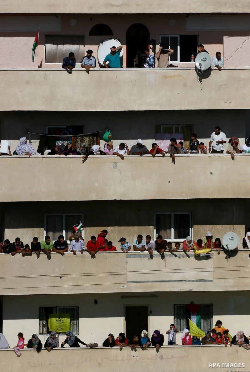 Thousands of Palestinians attend the welcome ceremony held for the Palestinian prisoners released from Israel in al-Katiba Yard in Gaza City, Oct. 18, 2011. Israel and the Palestinians finished on Tuesday the first phase...