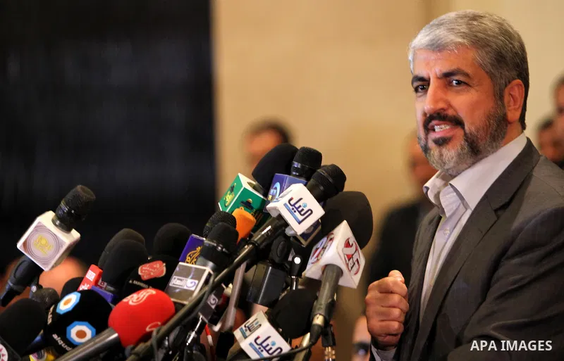 Exiled Palestinian Hamas leader Khaled Meshaal addresses a meeting with some 40 Palestinian prisoners who were freed by Israel but are to be deported overseas, in Cairo on October 18, 2011. Israeli soldier Gilad Shalit w...